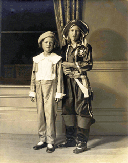 Siblings Jeffrey & Sally Ferguson at Mansion House Hotel costume dance, Fishers Island, NY, 1930. Jeffrey is an English school boy and Sally is a pirate. 